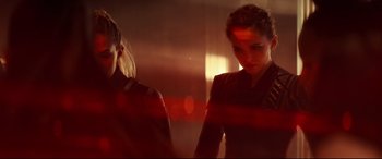 Movie still from “Black Widow” (2021), directed by Cate Shortland – Two women are standing next to each other in a room; Medium shot, Over the shoulder angle