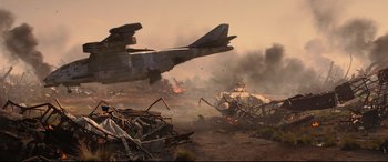 Movie still from “Black Widow” (2021), directed by Cate Shortland – An airplane is flying over a pile of debris; Extreme Wide shot, Low angle
