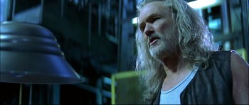 Movie still from “Blade” (1998), directed by Stephen Norrington – An older man with long white hair and a beard; Close Up shot, Low angle