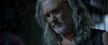 Movie still from “Blade” (1998), directed by Stephen Norrington – An older man with long hair and a beard; Close Up shot, Low angle