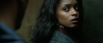 Movie still from “Blade” (1998), directed by Stephen Norrington – A person with long black hair; Close Up shot, Low angle