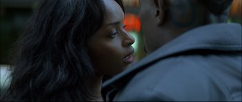 Movie still from “Blade” (1998), directed by Stephen Norrington – A woman's face as a man looks at her; Close Up shot, Over the shoulder angle