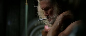 Movie still from “Blade” (1998), directed by Stephen Norrington – A person holding a cigarette in his mouth; Close Up shot, Low angle