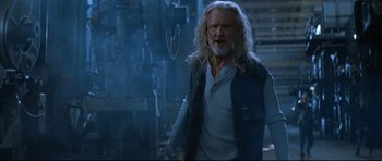 Movie still from “Blade” (1998), directed by Stephen Norrington – An older man with long hair and a beard; Medium shot, Low angle