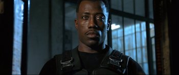 Movie still from “Blade” (1998), directed by Stephen Norrington – A person wearing a uniform; Close Up shot, Low angle