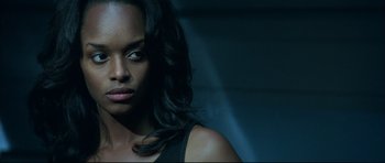 Movie still from “Blade” (1998), directed by Stephen Norrington – A woman with long black hair; Close Up shot, Low angle