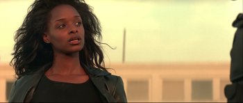 Movie still from “Blade” (1998), directed by Stephen Norrington – A person with long hair; Close Up shot, Low angle