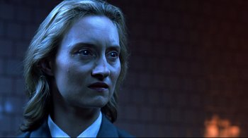 Movie still from “Blade II” (2002), directed by Guillermo del Toro – A person wearing a suit and tie; Close Up shot, Low angle