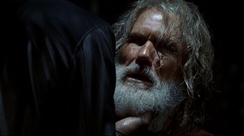 Movie still from “Blade II” (2002), directed by Guillermo del Toro – An old man with a long white beard; Close Up shot, Over the shoulder angle
