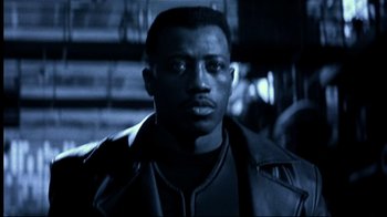 Movie still from “Blade II” (2002), directed by Guillermo del Toro – A man in a leather jacket is looking at the camera; Close Up shot, Low angle