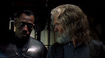 Movie still from “Blade II” (2002), directed by Guillermo del Toro – A man with long white hair standing next to a man with long white hair; Close Up shot, Over the shoulder angle