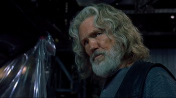 Movie still from “Blade II” (2002), directed by Guillermo del Toro – A person with long hair and a beard; Close Up shot, Over the shoulder angle