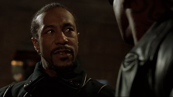 Movie still from “Blade II” (2002), directed by Guillermo del Toro – A man wearing a black jacket is talking to another man; Close Up shot, Low angle