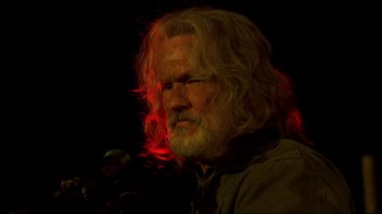 Movie still from “Blade II” (2002), directed by Guillermo del Toro – An old man with long hair and a goatee; Close Up shot, Low angle