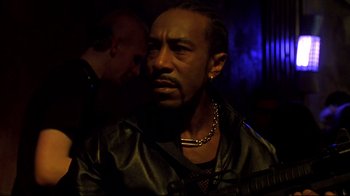 Movie still from “Blade II” (2002), directed by Guillermo del Toro – A person wearing a leather jacket; Close Up shot, Low angle