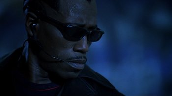 Movie still from “Blade II” (2002), directed by Guillermo del Toro – A person wearing sunglasses; Close Up shot, Low angle