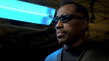Movie still from “Blade II” (2002), directed by Guillermo del Toro – A person wearing sunglasses; Close Up shot, Low angle