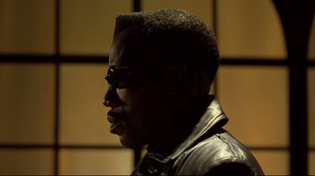 Movie still from “Blade II” (2002), directed by Guillermo del Toro – A man in a black leather jacket looking to the side; Close Up shot, Low angle