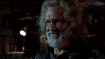 Movie still from “Blade II” (2002), directed by Guillermo del Toro – An older man with long white hair and a beard; Close Up shot, Low angle