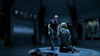 Movie still from “Blade II” (2002), directed by Guillermo del Toro – A man and a woman are standing in a room; Wide shot, Over the shoulder angle