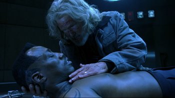 Movie still from “Blade II” (2002), directed by Guillermo del Toro – A man with long white hair is touching a man's chest; Close Up shot, Over the shoulder angle