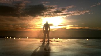 Movie still from “Blade II” (2002), directed by Guillermo del Toro – A man standing in front of the sun setting; Extreme Wide shot, Low angle
