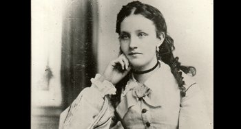 Movie still from “Tesla” (2020), directed by Michael Almereyda – An old photo of a woman in a white dress; Close Up shot, Low angle