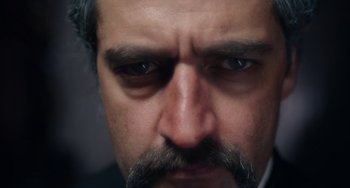 Movie still from “Tesla” (2020), directed by Michael Almereyda – A person with a beard; Extreme Close Up shot, High angle