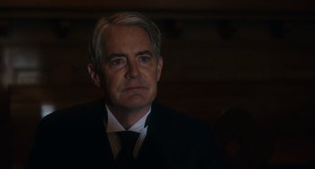 Movie still from “Tesla” (2020), directed by Michael Almereyda – A person wearing a suit and tie; Close Up shot, Low angle