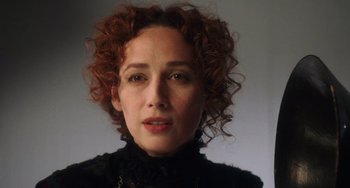 Movie still from “Tesla” (2020), directed by Michael Almereyda – A person with curly red hair; Close Up shot, Low angle