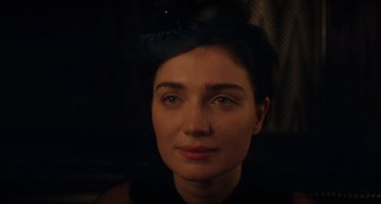 Movie still from “Tesla” (2020), directed by Michael Almereyda – A person wearing a hat; Close Up shot, Over the shoulder angle