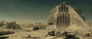 Movie still from “Blade: Trinity” (2004), directed by David S. Goyer – A helicopter is flying over a large rock formation; Extreme Wide shot, Low angle