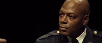 Movie still from “Blade: Trinity” (2004), directed by David S. Goyer – A person wearing a uniform; Close Up shot, Over the shoulder angle