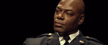 Movie still from “Blade: Trinity” (2004), directed by David S. Goyer – A person wearing a uniform; Close Up shot, Low angle