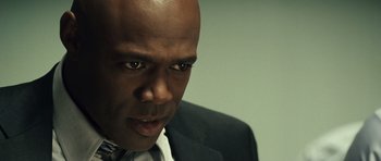 Movie still from “Blade: Trinity” (2004), directed by David S. Goyer – A person wearing a suit and tie; Close Up shot, Low angle