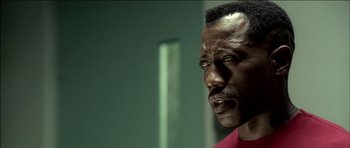 Movie still from “Blade: Trinity” (2004), directed by David S. Goyer – A person looking at the camera; Close Up shot, High angle