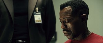 Movie still from “Blade: Trinity” (2004), directed by David S. Goyer – A person wearing a red shirt; Close Up shot, Over the shoulder angle