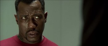 Movie still from “Blade: Trinity” (2004), directed by David S. Goyer – A person wearing a red shirt; Close Up shot, High angle