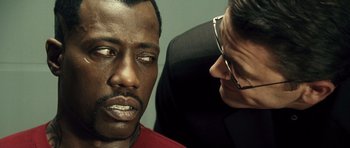 Movie still from “Blade: Trinity” (2004), directed by David S. Goyer – A man and a woman looking at one another; Close Up shot, Over the shoulder angle