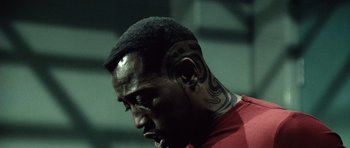 Movie still from “Blade: Trinity” (2004), directed by David S. Goyer – A person with tattoos on his head; Close Up shot, High angle