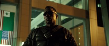 Movie still from “Blade: Trinity” (2004), directed by David S. Goyer – A man in a leather jacket standing in front of a building at night; Close Up shot, Low angle