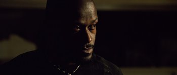 Movie still from “Blade: Trinity” (2004), directed by David S. Goyer – A person wearing a black shirt; Close Up shot, Low angle