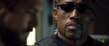 Movie still from “Blade: Trinity” (2004), directed by David S. Goyer – A person wearing sunglasses; Close Up shot, Low angle