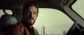 Movie still from “Blade: Trinity” (2004), directed by David S. Goyer – A person in a car looking out of the window; Close Up shot, Over the shoulder angle