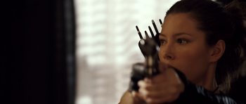 Movie still from “Blade: Trinity” (2004), directed by David S. Goyer – A woman holding a pair of forks in her hand; Close Up shot, Over the shoulder angle