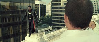 Movie still from “Blade: Trinity” (2004), directed by David S. Goyer – A man is standing on the edge of a building; Wide shot, Over the shoulder angle