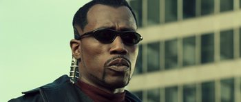 Movie still from “Blade: Trinity” (2004), directed by David S. Goyer – A person with sunglasses on; Close Up shot, Low angle