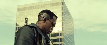 Movie still from “Blade: Trinity” (2004), directed by David S. Goyer – A person with a tattoo on his head; Close Up shot, Low angle