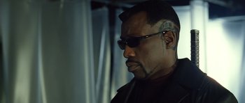Movie still from “Blade: Trinity” (2004), directed by David S. Goyer – A person wearing sunglasses; Close Up shot, Low angle