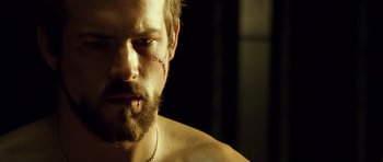 Movie still from “Blade: Trinity” (2004), directed by David S. Goyer – A person with a scar on his face; Close Up shot, Low angle